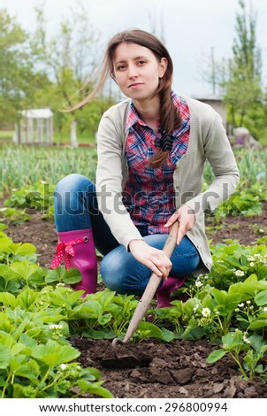 Garden Works. Young Woman Working in the Garden. Healthy Lifestyle