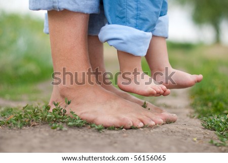 Happy Family On A Walk In Summer. Child With Father Together. Feet ...