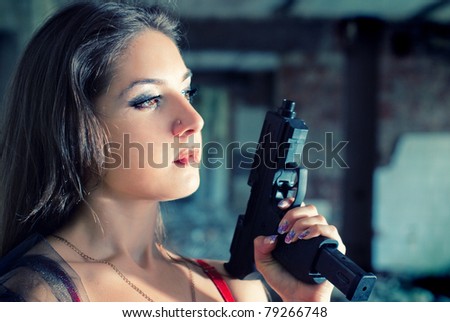 Beautiful woman with gun