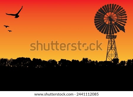 silhouette of windmill and gum tree, three birds flying in the sunset