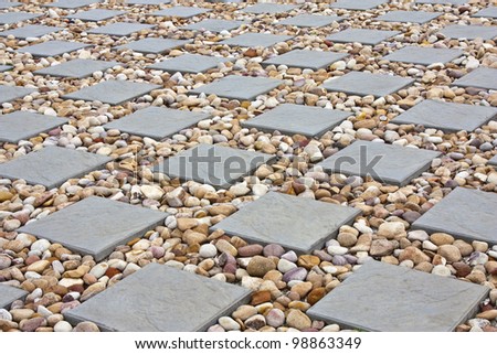 square paving with small stones in between