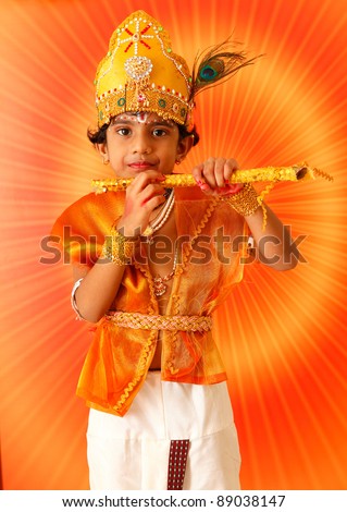 Indian child with god krishna make up.