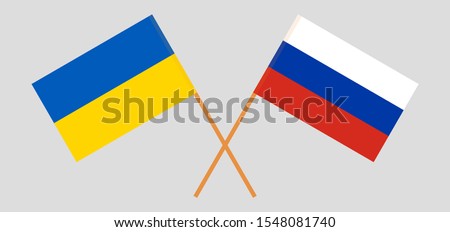 Crossed flags of the Ukraine and Russia