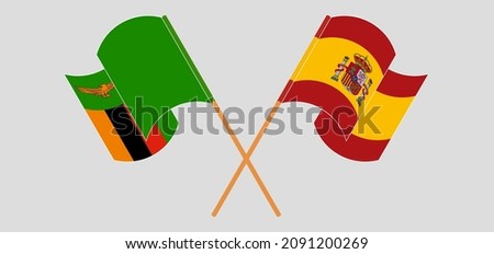 Crossed and waving flags of Spain and Zambia. Vector illustration
