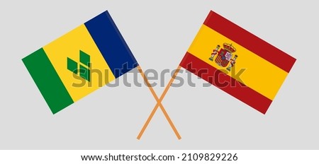 Crossed flags of Saint Vincent and the Grenadines and Spain. Official colors. Correct proportion. Vector illustration
