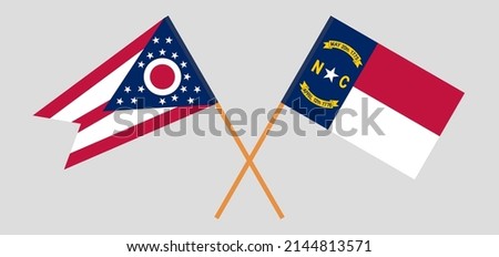 Crossed flags of the State of Ohio and The State of North Carolina. Official colors. Correct proportion. Vector illustration
