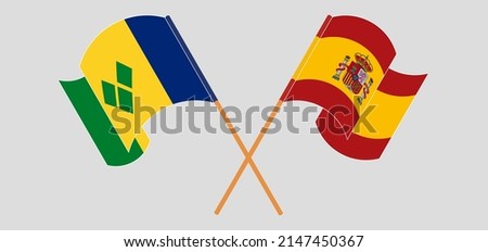 Crossed flags of Spain and Saint Vincent and the Grenadines. Official colors. Correct proportion. Vector illustration
