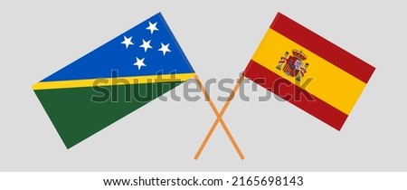 Crossed flags of Solomon Islands and Spain. Official colors. Correct proportion. Vector illustration
