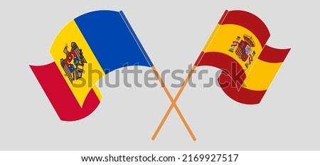 Crossed and waving flags of Moldova and Spain. Vector illustration
