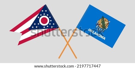 Crossed flags of the State of Ohio and The State of Oklahoma. Official colors. Correct proportion. Vector illustration

