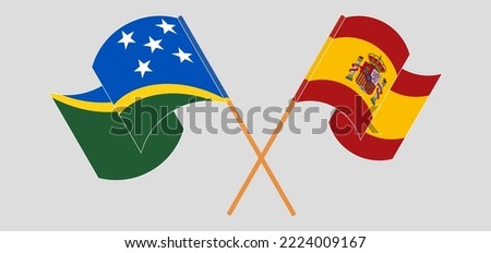 Crossed and waving flags of Solomon Islands and Spain. Vector illustration
