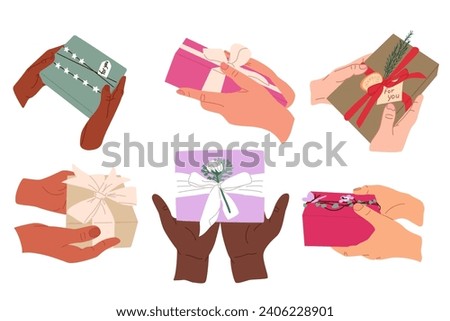 Multicultural human hands with wrapped gift. Birthday, Valentines, anniversary, Christmas concept compositions. Different color skin hands giving gift