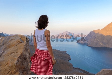 Similar – Image, Stock Photo female traveler admiring a marine view. tourism in Cyprus. tourist on sea background. girl travels on the beaches. young beautiful hipster woman on tropical beach, summer vacation, happy, fun,