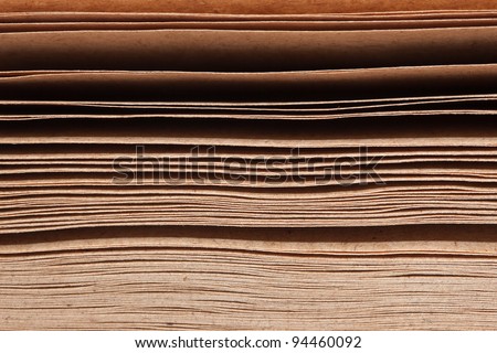 Close-up picture showing stack of brown papers