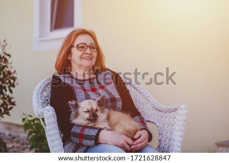 Similar – Image, Stock Photo Lady sitting on sandy coast near sea