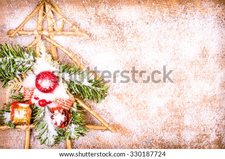 Christmas snowy tree with red balls and gift.  Wooden New Year decoration. Free space for text
