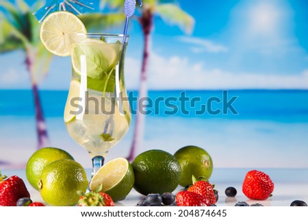 Tropical drinks on beach and sun