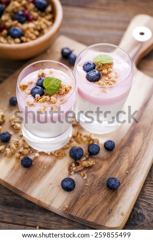 Delicious dessert with fruits and flakes on a wooden table. Studio shot