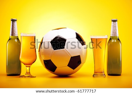 Perfect chilled beer on yellow background