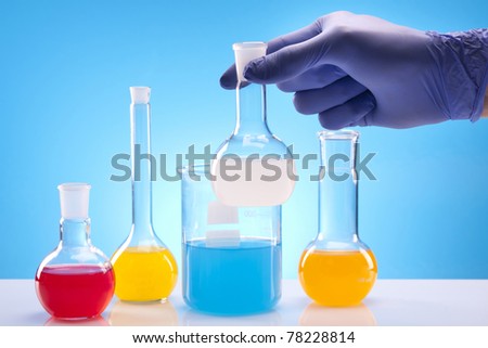 Scientist Experimenting with fluids in laboratory