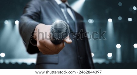 Similar – Image, Stock Photo Man holds a microphone in his hand ready to speak