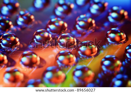Abstract background. Varicolored dripped water.