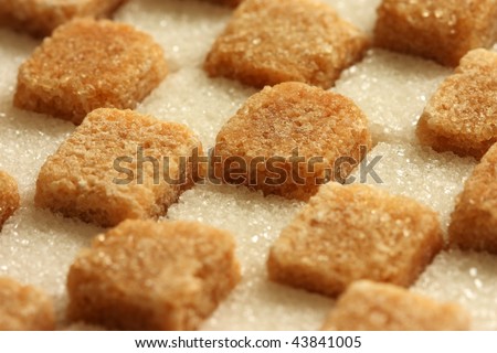 Checked pattern made of brown and white sugar cubes