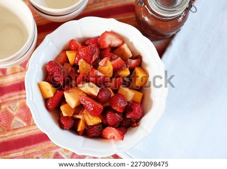 Similar – Image, Stock Photo Fresh strawberries and rhubarb on wooden table background with ingredients for tasty seasonal cooking or baking. Top view. Healthy clean food. Paleo dieting. Home cuisine. Garden fruits eating