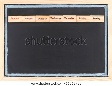 Monthly calendar with week words print on wood on blackboard