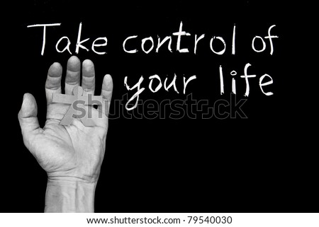 Take control of your life. Words and human hand  on blackboard.