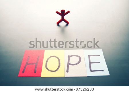 Colorful hope word and single person with back light shadow