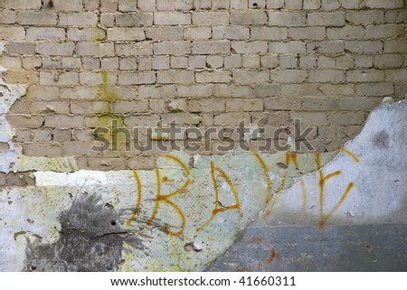 Background. Old brick wall with the fallen off plaster