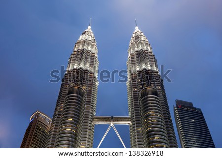 KUALA LUMPUR - APRIL 26 : The Petronas Twin Towers (KLCC) with blue skies on April 26,2013 in Kuala Lumpur, Malaysia. The skyscraper (451.9m/88 floors) remain the tallest twin buildings in the world.