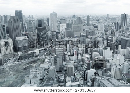 OSAKA,JAPAN - APRIL 21 : Osaka cityscape with corporate logos visible on April 21,2015 in Osaka, Japan. The city is third largest in the country with a population of over 2.6 million.