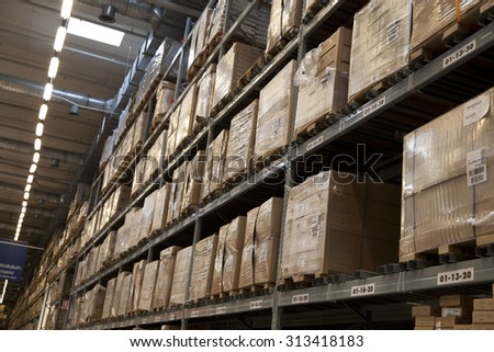 Rows of shelves with boxes in factory warehouse