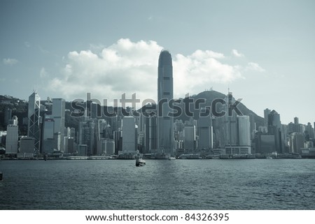 HONG KONG - JULY 5 : Ferry cruising Victoria harbor with Hong Kong skyline in the background on July 5,2011 in Hong Kong. Ferry is in operation for more than 120 years in