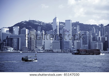 HONG KONG - JULY 5 : Ferry cruising Victoria harbor with Hong Kong skyline in the background on July 5, 2011 in Hong Kong, China. The ferry company has been in operation for more than 120 years.