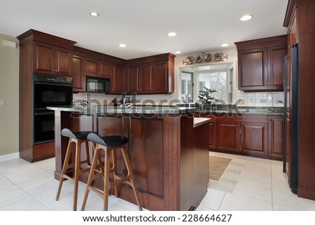 Kitchen with cherry wood cabinetry and center island