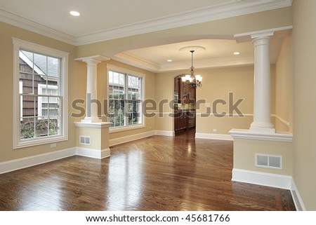 Living And Dining Room With White Pillars In New Construction Home Living And Dining Room With White Pillars In New Construction Home