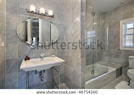 Master bath in luxury home with gray tile