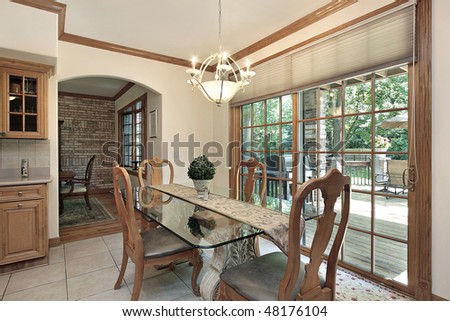 Eating area of kitchen with deck view