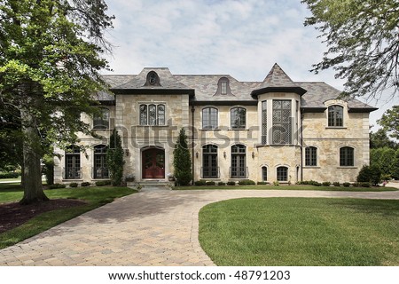 Luxury stone home in suburbs with turret