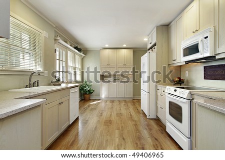 Kitchen in remodeled home with eating area