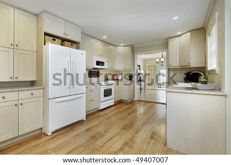 Kitchen in remodeled home with dining room view
