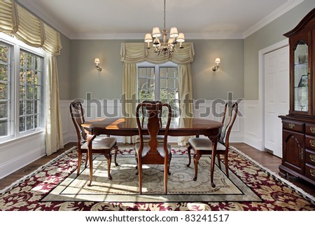 Dining room with decorative rug and buffet