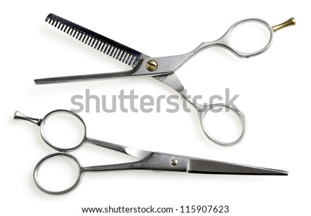Professional hairdressing scissors on white background