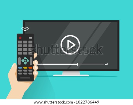 Remote control in hand near flat screen tv watching video film, cartoon person watching movie or film on television display