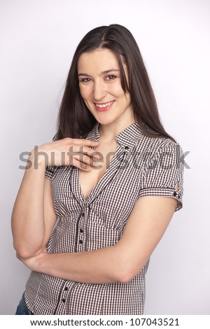 young beautiful woman wearing a smart blouse with her arms crossed