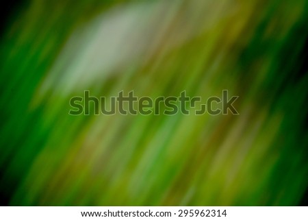 Green background with bright colours represented from top right corner to low left corner. Background green dark abstract pattern.