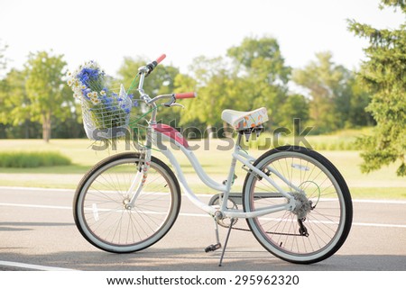 Beautiful white bicycle for riding isolated on nature backgroung. Fashionable two-wheeled bicycle isolated on nature.